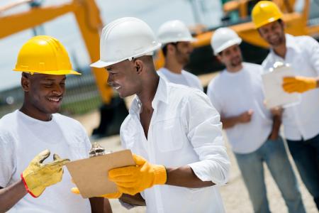 Group working on construction site 